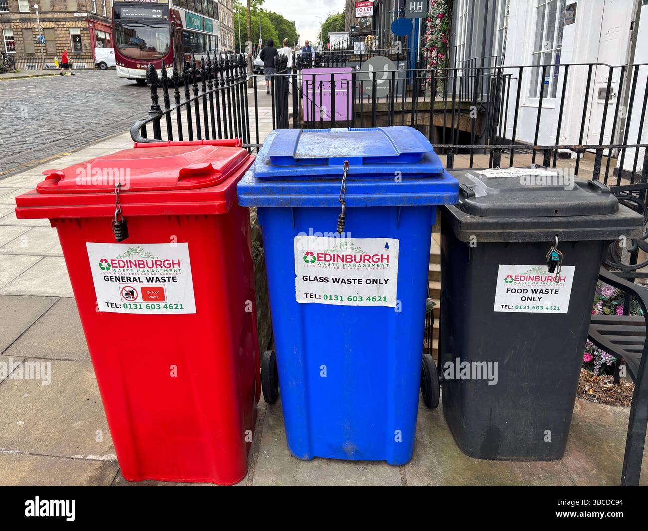 Glass and Food waste Recycling bins and General waste bin on an Edinburgh Street, Edinburgh Scotland - Smartphone Captured Stock Image
