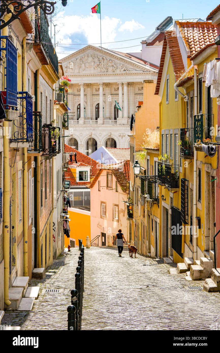 Narrow cobblestone street with traditional buildings and historic ...