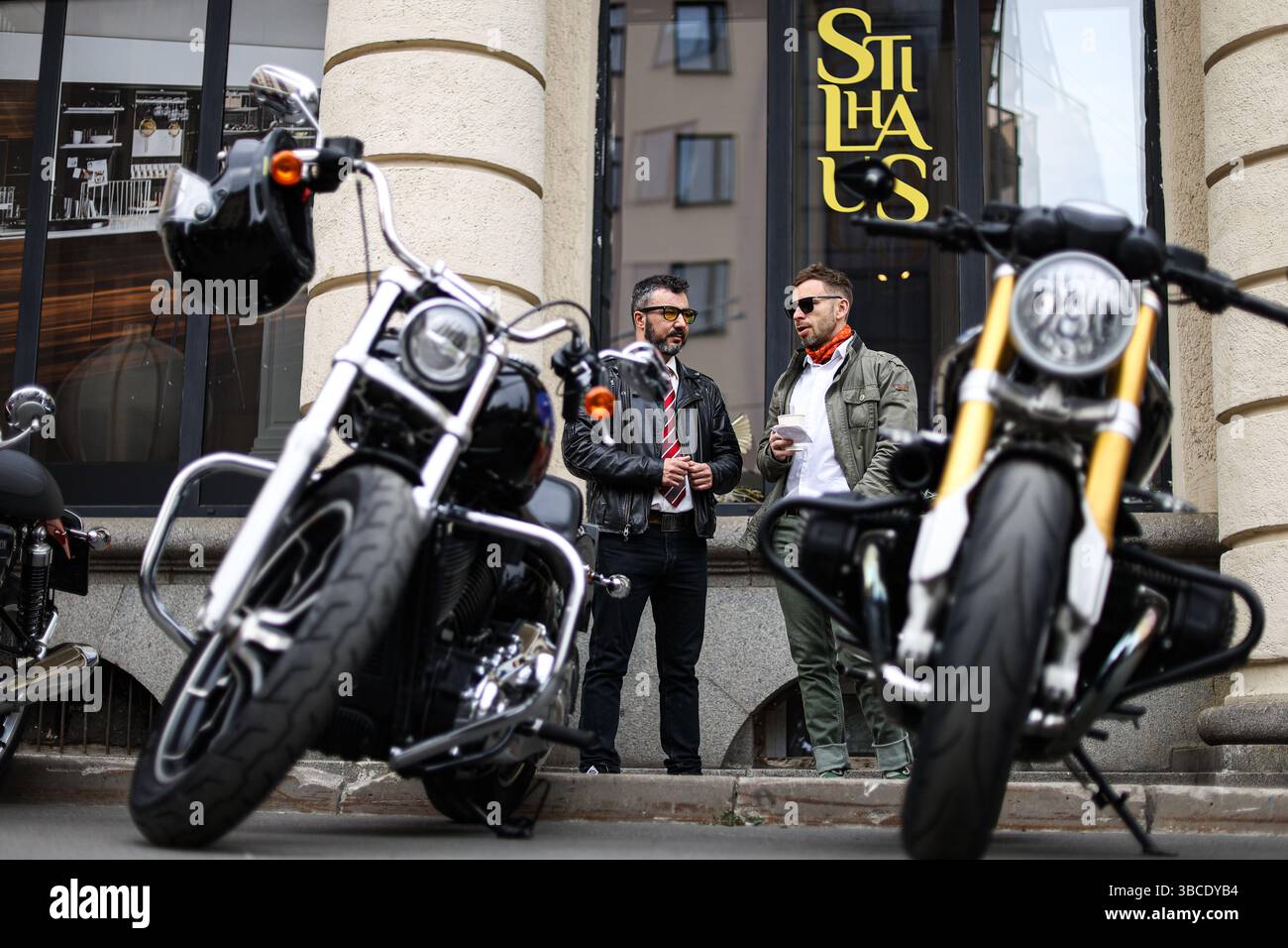 Participants for the Distinguished Gentleman's Ride gather next to ...