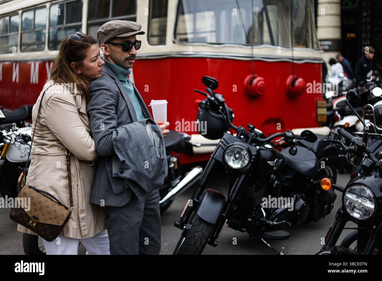 Participants for the Distinguished Gentleman's Ride gather next to ...