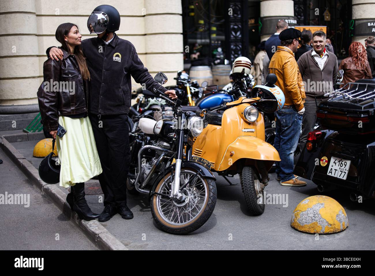 Participants for the Distinguished Gentleman's Ride gather next to ...