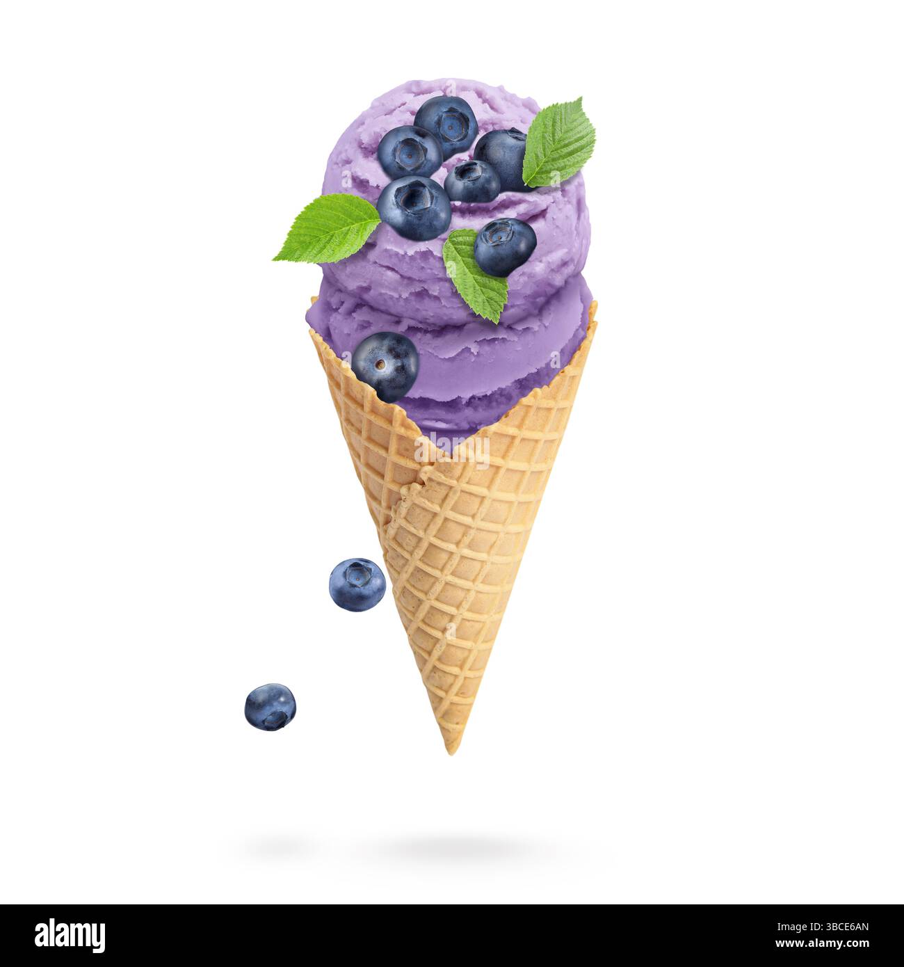 Yummy blueberry ice cream cone and berries in air on white background ...