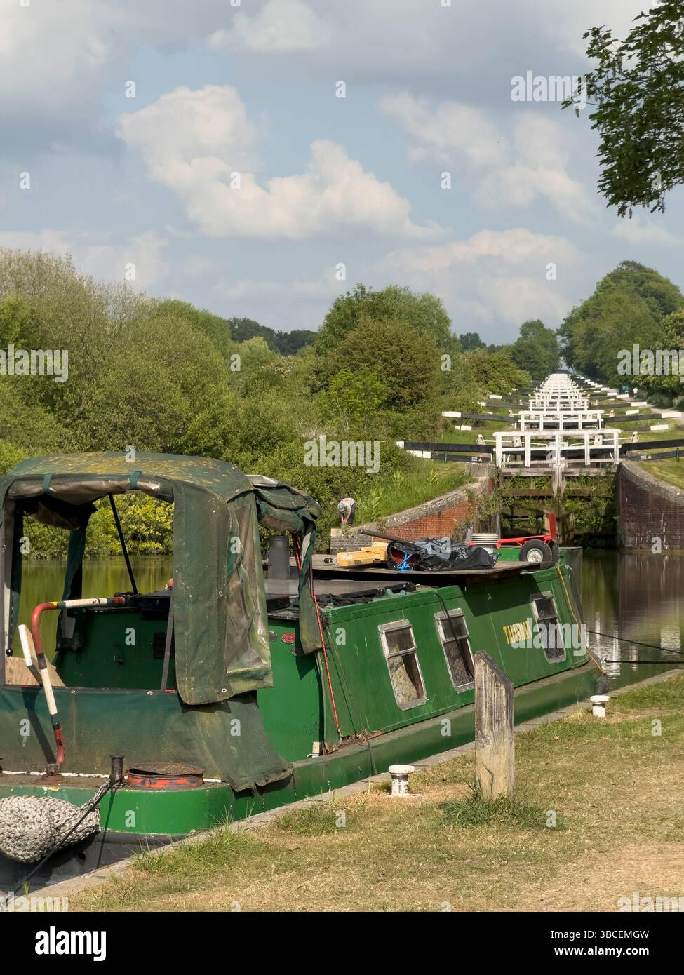 Devizes Wiltshire England UK. 19.05.2025. A residential canal boat on the Kennet and Avon Canal at Rowde Devizes at the foot of the  Caen Hill locks Stock Photo