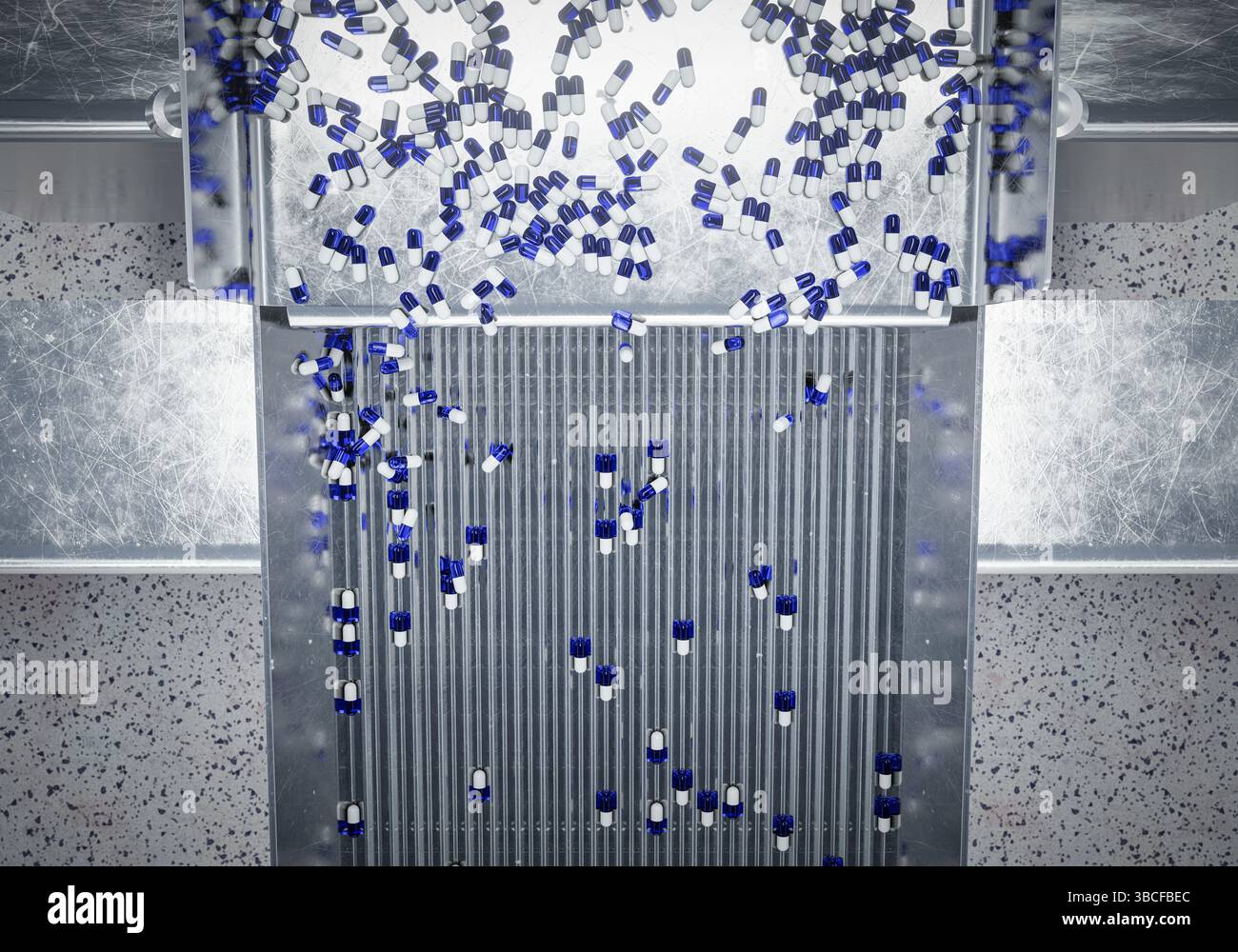 Blue Processing Pack Blue and white capsules sorted in a pharmaceutical processing machine ...