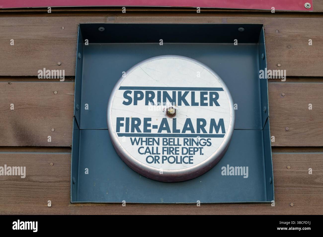 Sprinkler fire alarm bell on building wall outdoors Stock Photo - Alamy