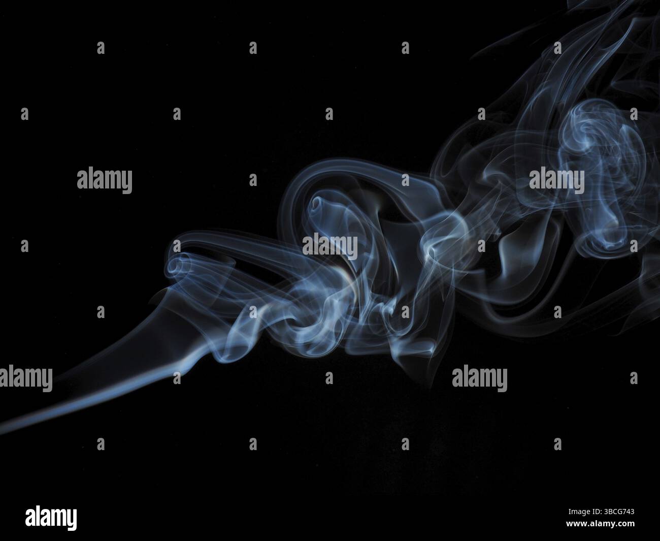 Abstract smoke in blue on a black studio background Stock Photo