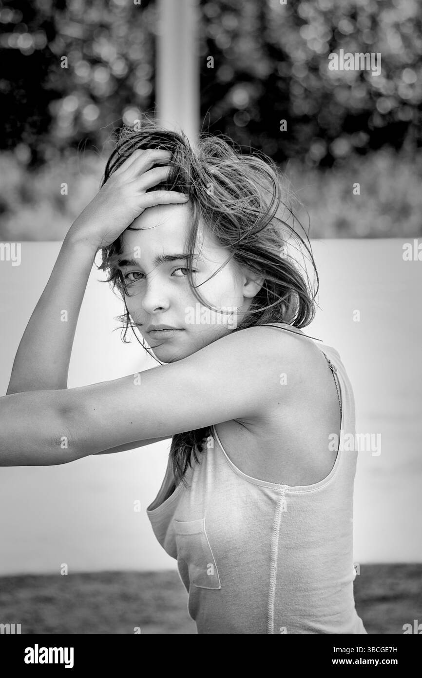 Portrait of a girl, one hand in here hair Stock Photo