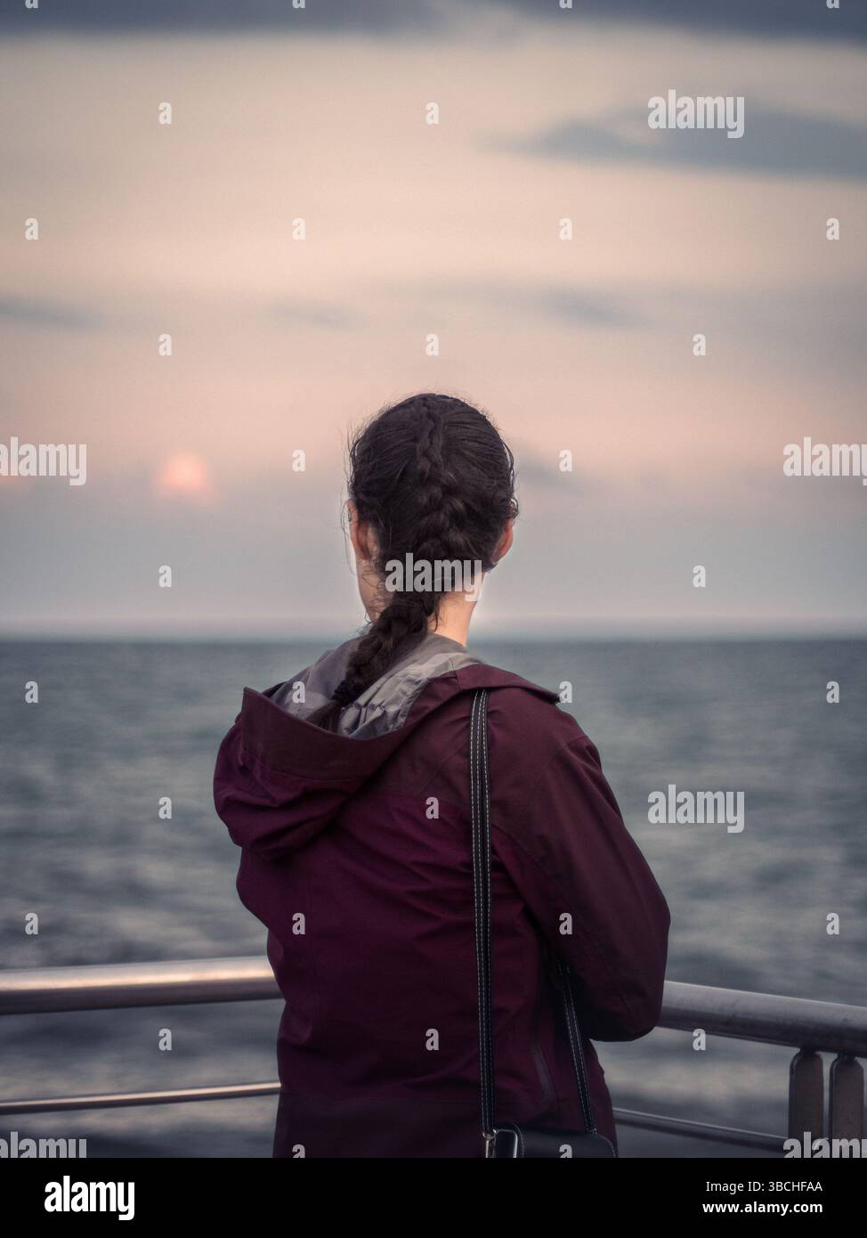 Woman stands railing gazing hi-res stock photography and images - Alamy