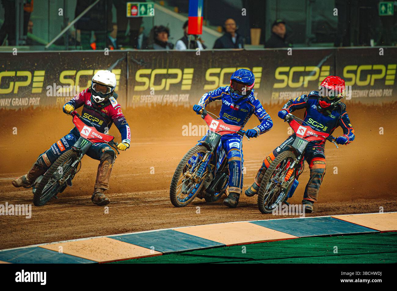 WARSZAWA, POLAND – MAY 17, 2025: Orlen Oil FIM Speedway Grand Prix of Poland in PGE Narodowy 2025. In photo from left; Dominik Kubera (white helmet) ; Bartosz Zmarzlik (blue helmet); Andzejs Lebedevs (red). Stock Photo