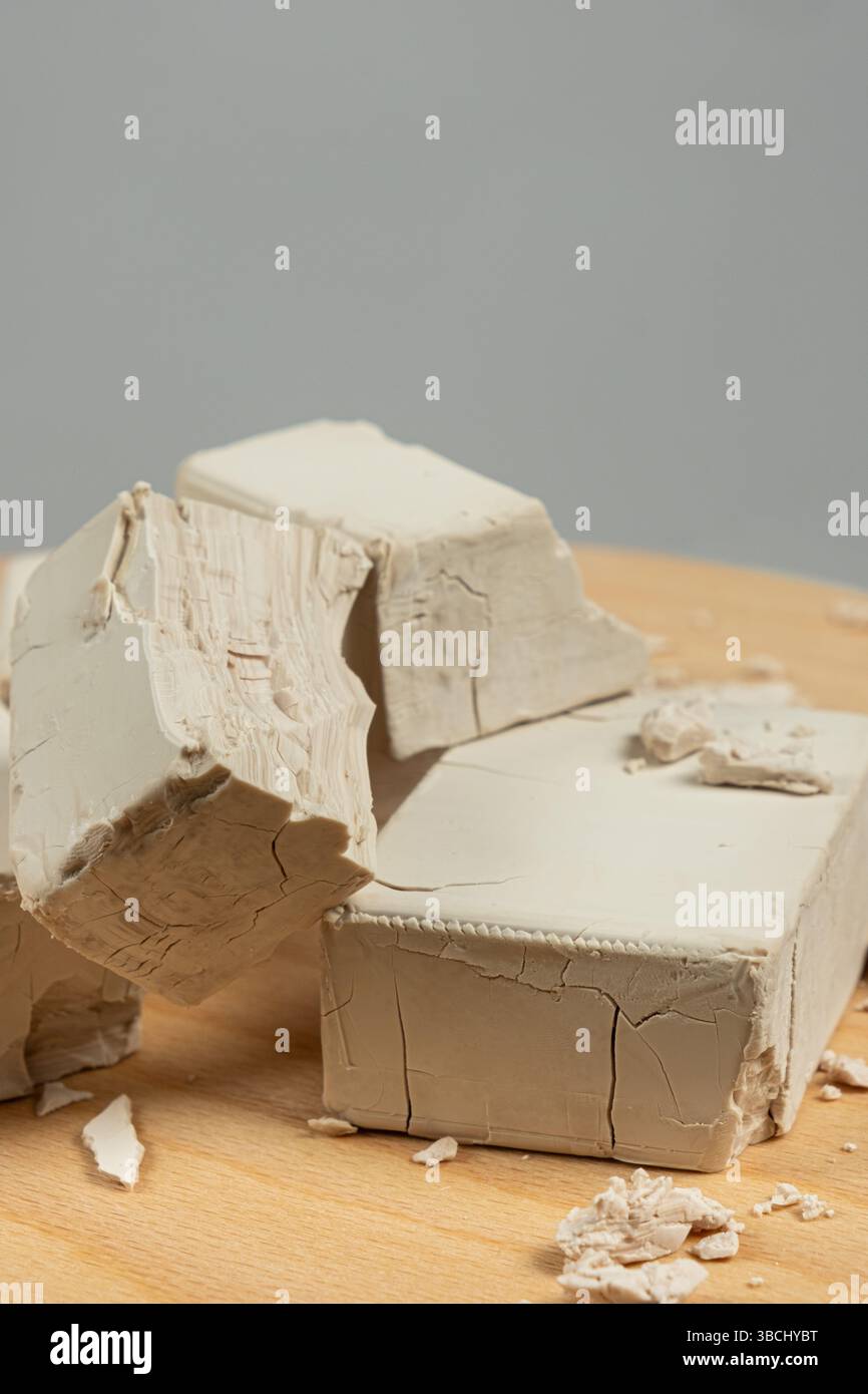 Fresh Compressed Yeast Blocks on Gray Background Stock Photo