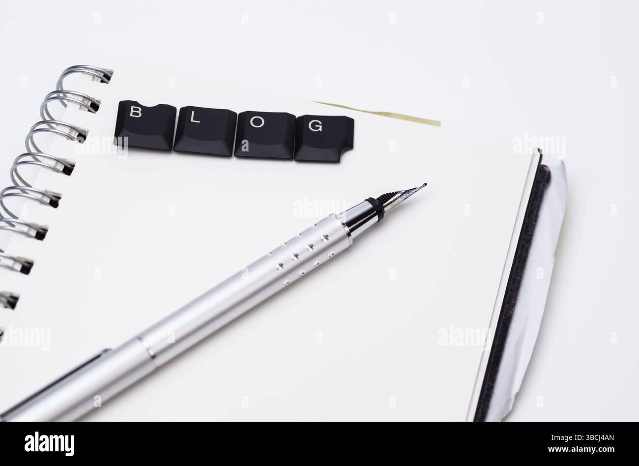 Image shows an opened notepad with pencil and characters Stock Photo ...