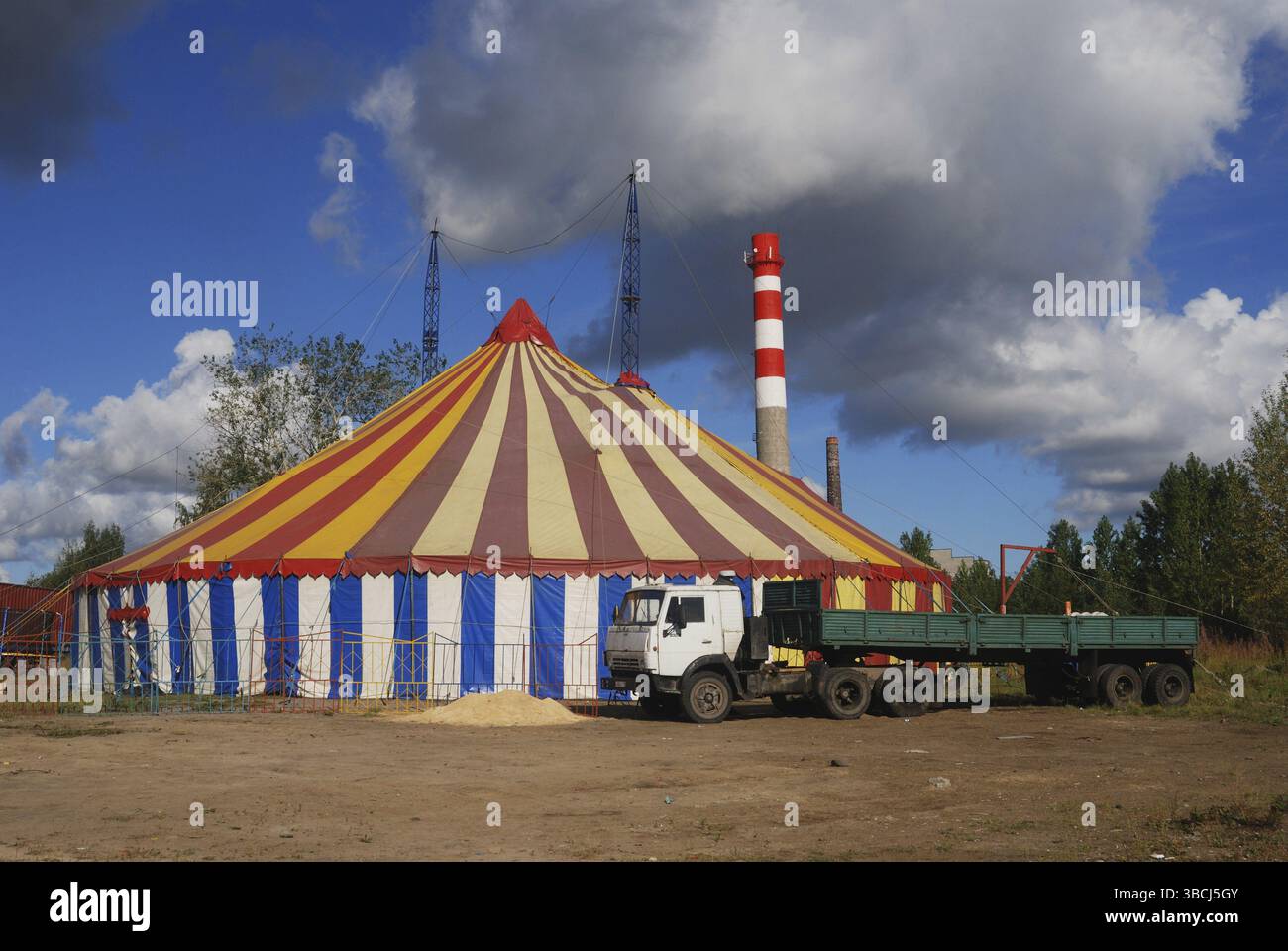 Striped circus tent, white, red, blue, yellow Stock Photo - Alamy