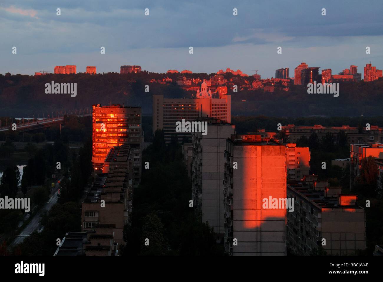Ukraine High Rises The rising sun casts red light on high-rise residential buildings, Kyiv ...