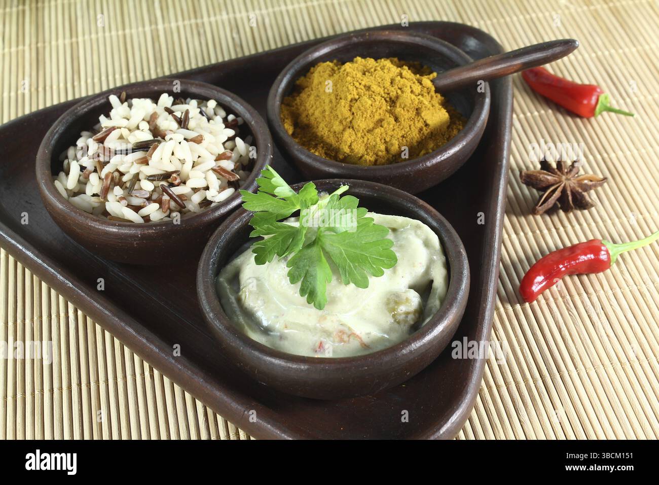 Indian green curry with wild rice, chilli and bamboo shoots Stock Photo ...