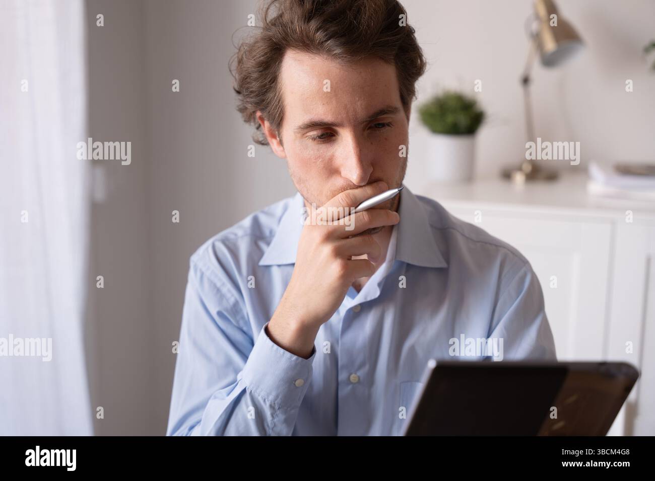 Man working remotely with a positive attitude Stock Photo