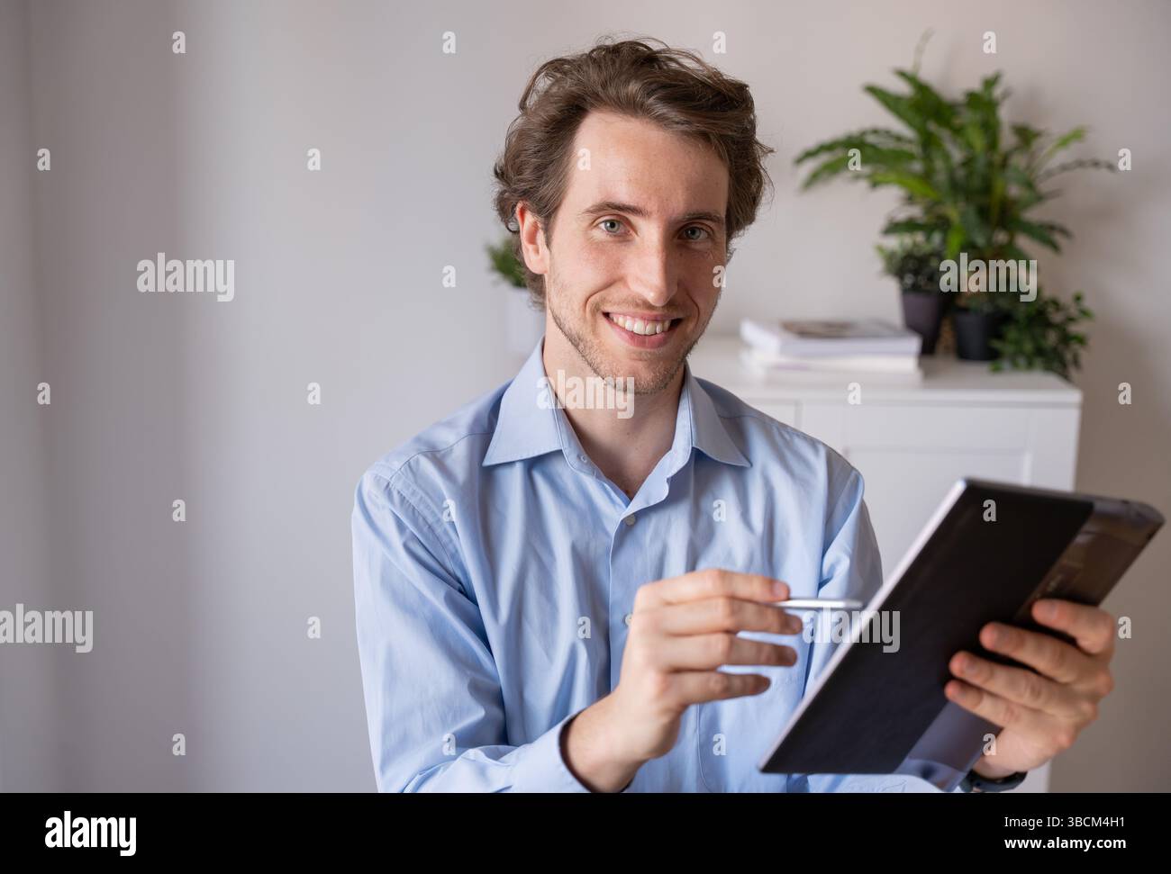 Man working remotely with a positive attitude Stock Photo