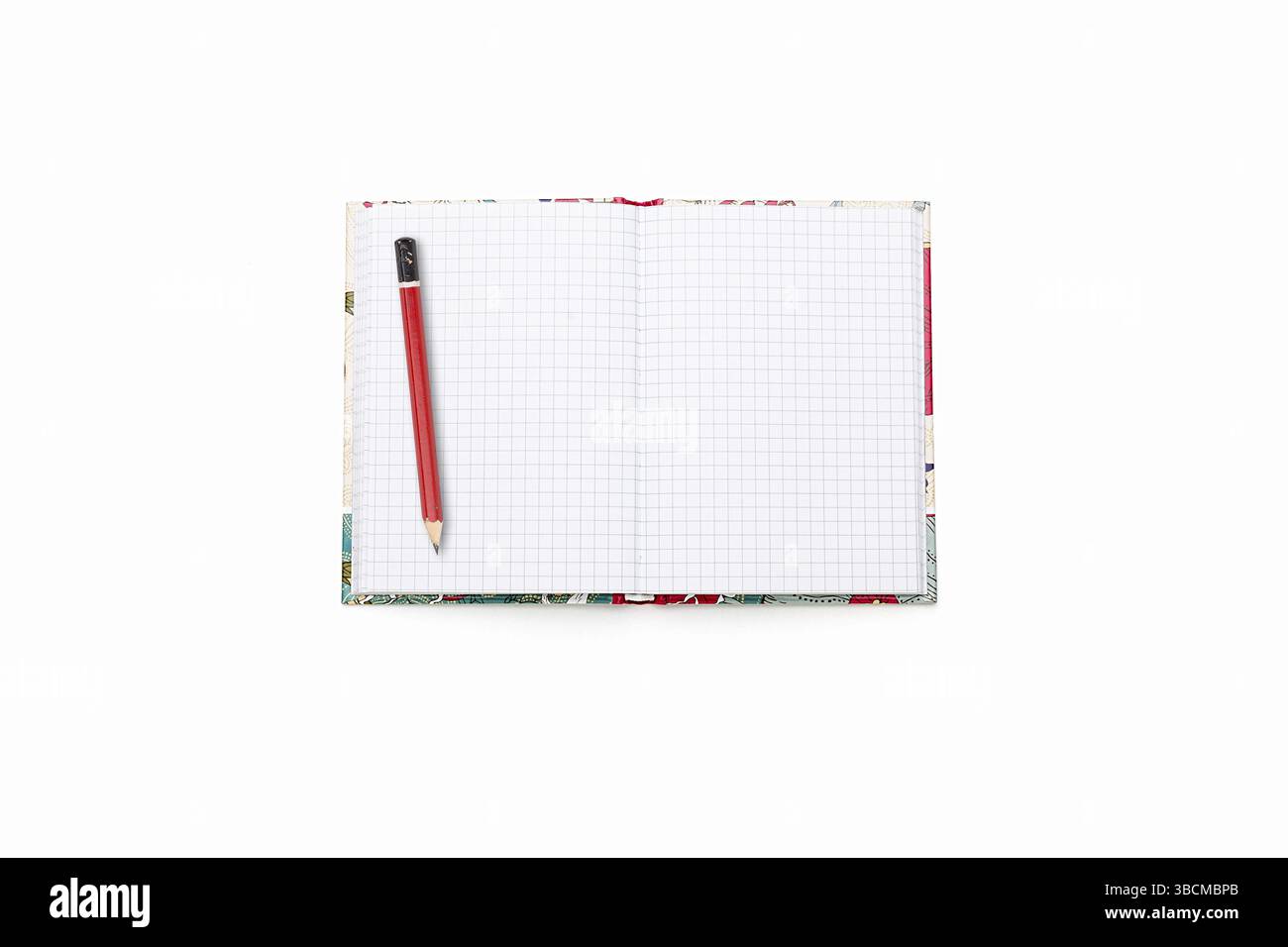 Blank open squared text book with red pencil, isolated on white Stock Photo