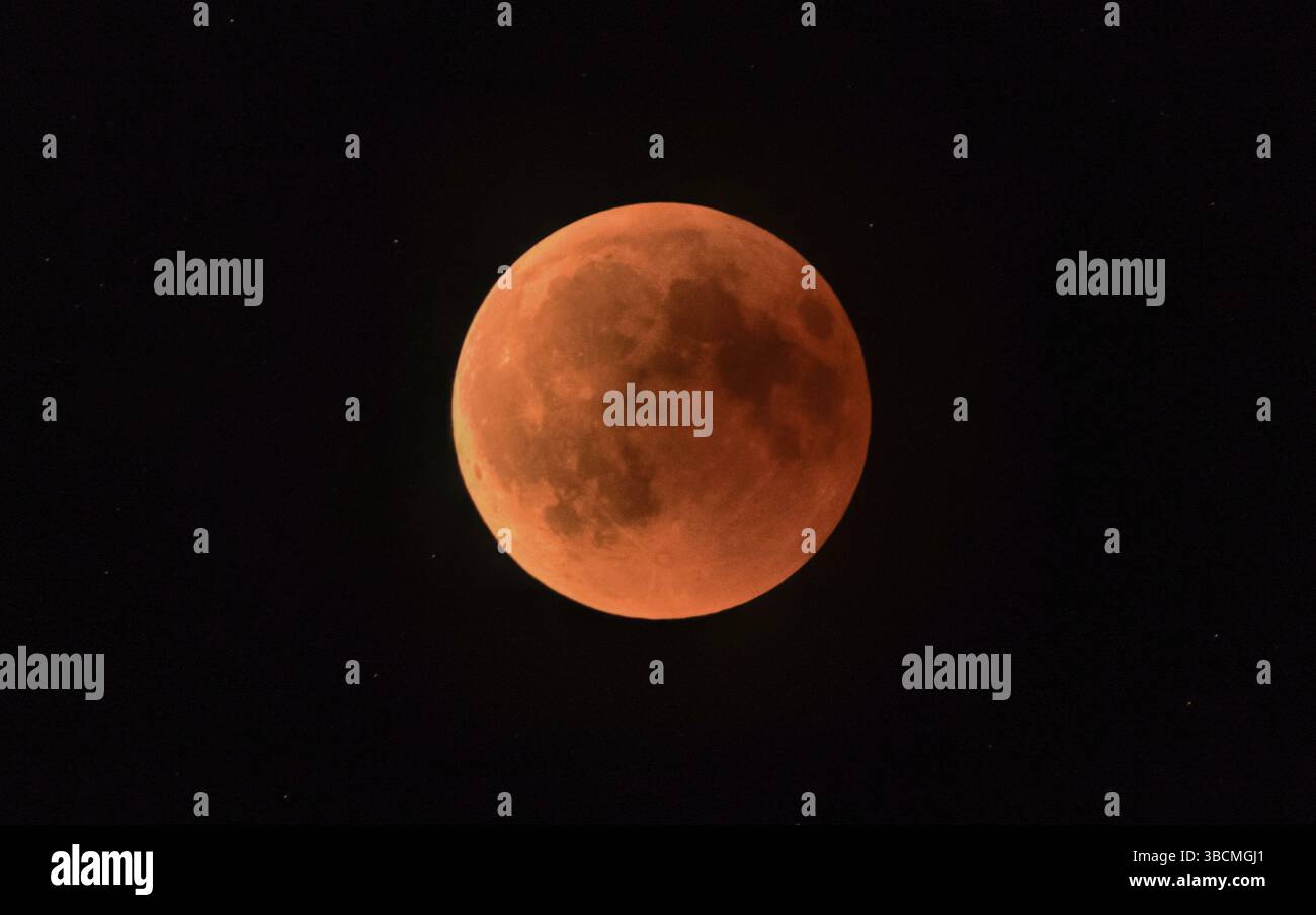 a full moon or blood moon during a complete lunar eclipse in a black ...