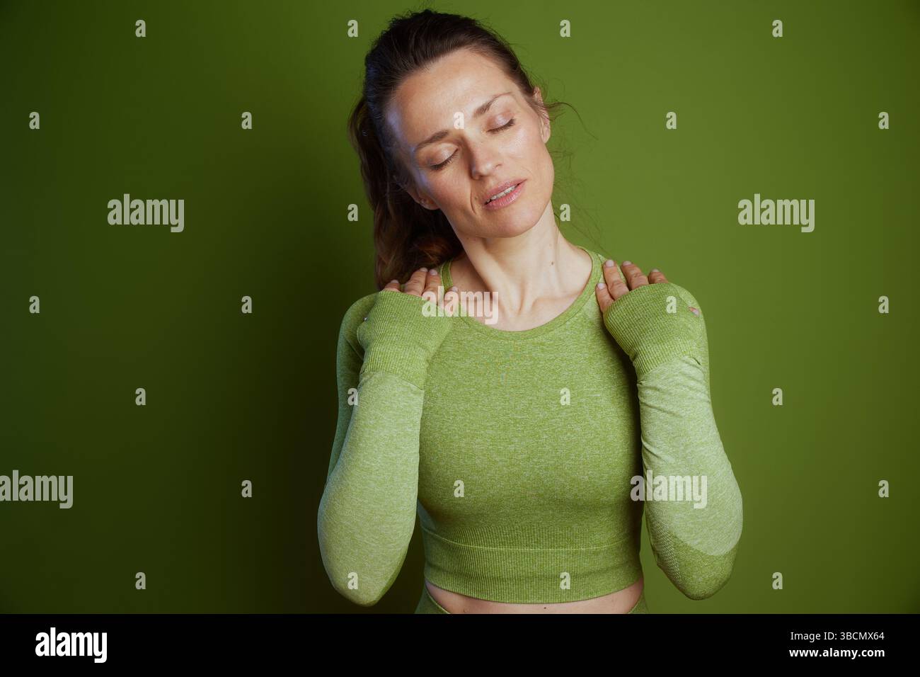 Young woman gently stretching neck hi-res stock photography and images ...