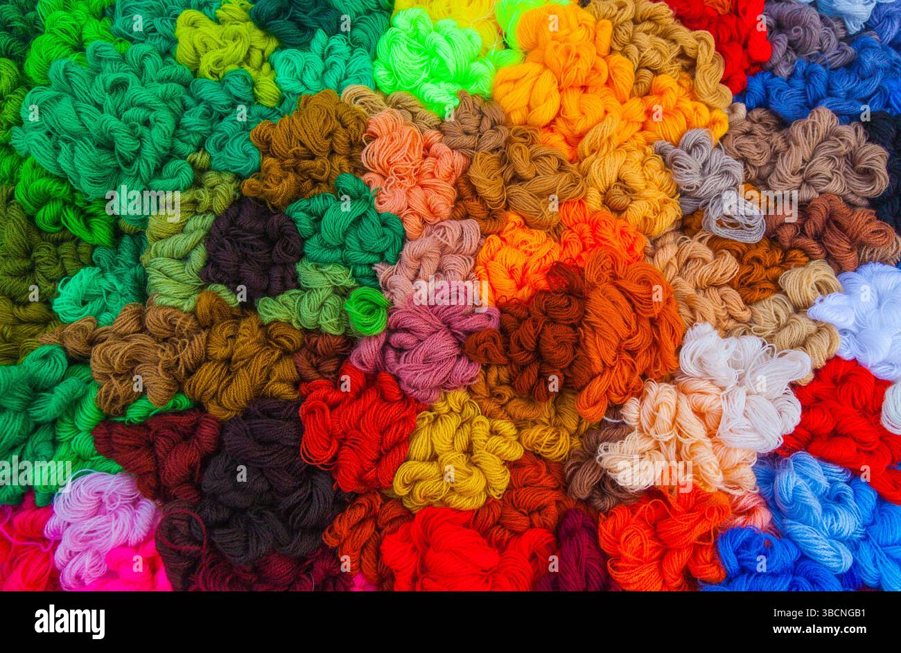Yarn. Background from multi-colored threads for knitting closeup. Stock Photo