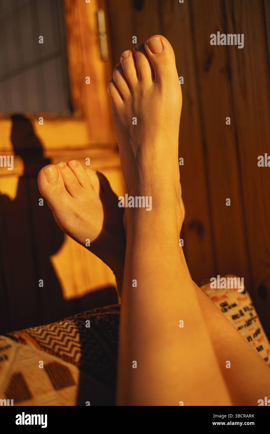 Barefoot woman resting feet hi-res stock photography and images - Alamy