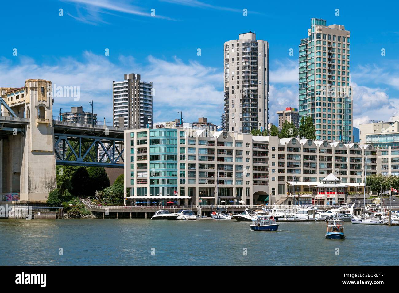 Vancouver city skyline by Granville Island and the Fraser River, British Columbia, Canada. Stock Photo
