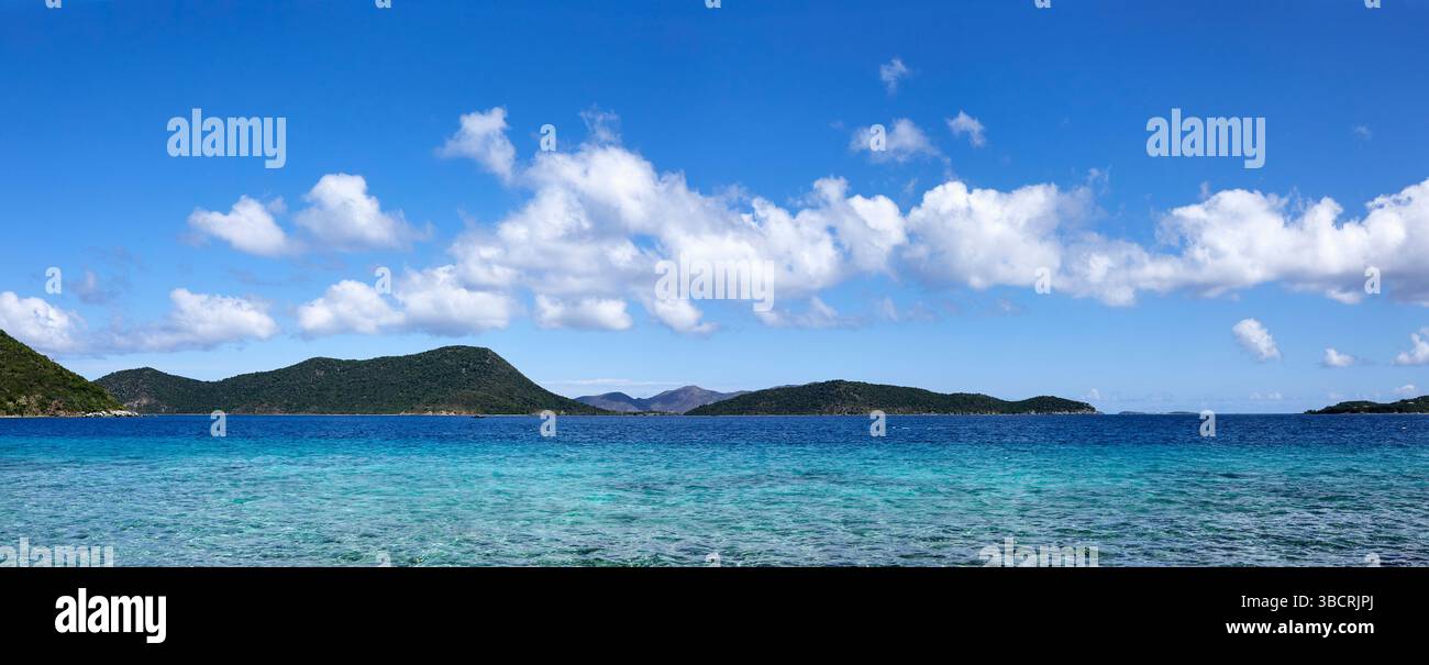 Blue sky with puffy clouds over Caribbean sea Stock Photo