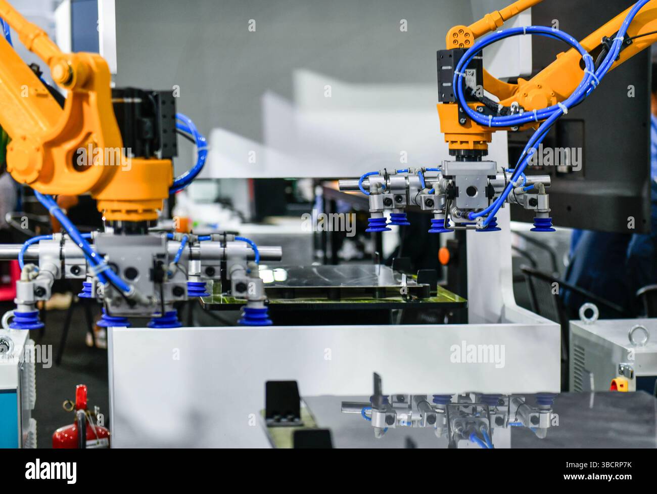 Robot arm control the Steel sheet cutting process in the industrial factory Stock Photo