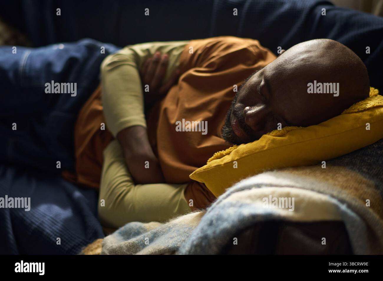 Resting Man Sleeping Peacefully on Couch Stock Photo
