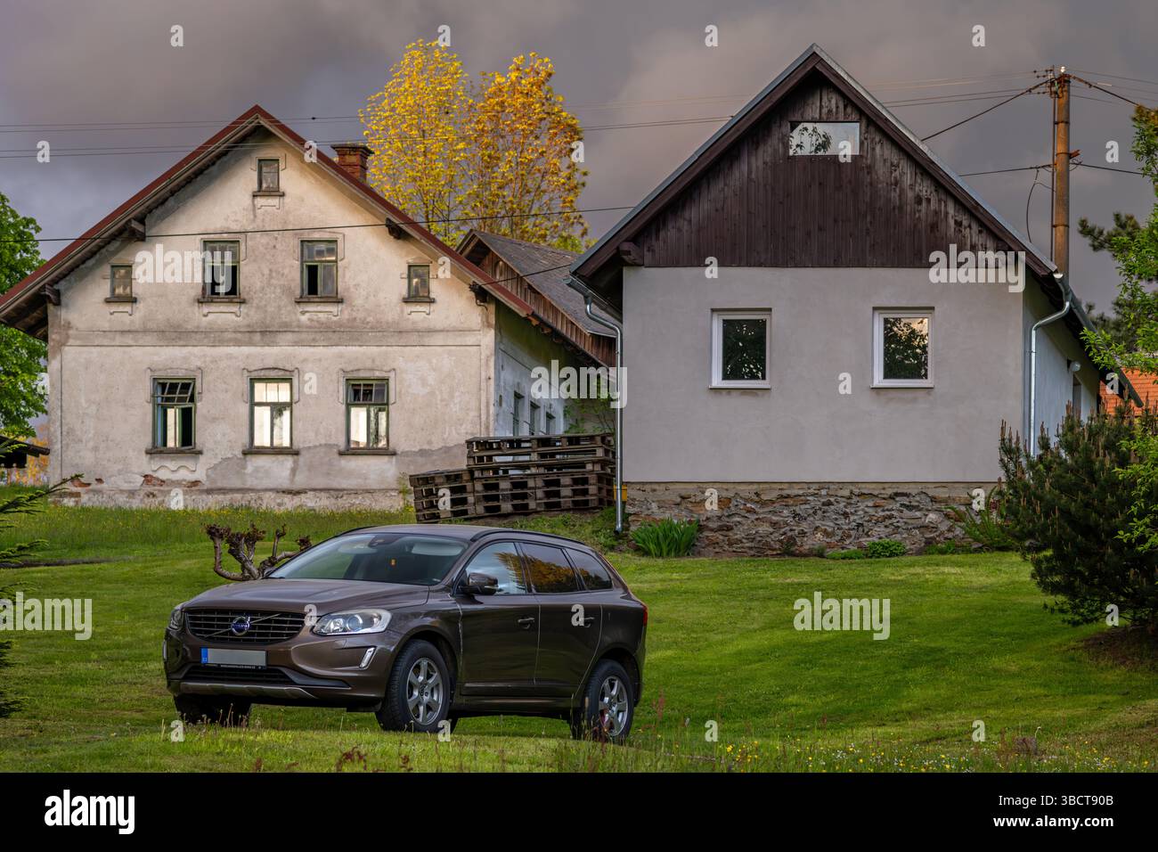 Parking cars in spring fresh mountains in village Roprachtice CZ 05 10 2025 Stock Photo