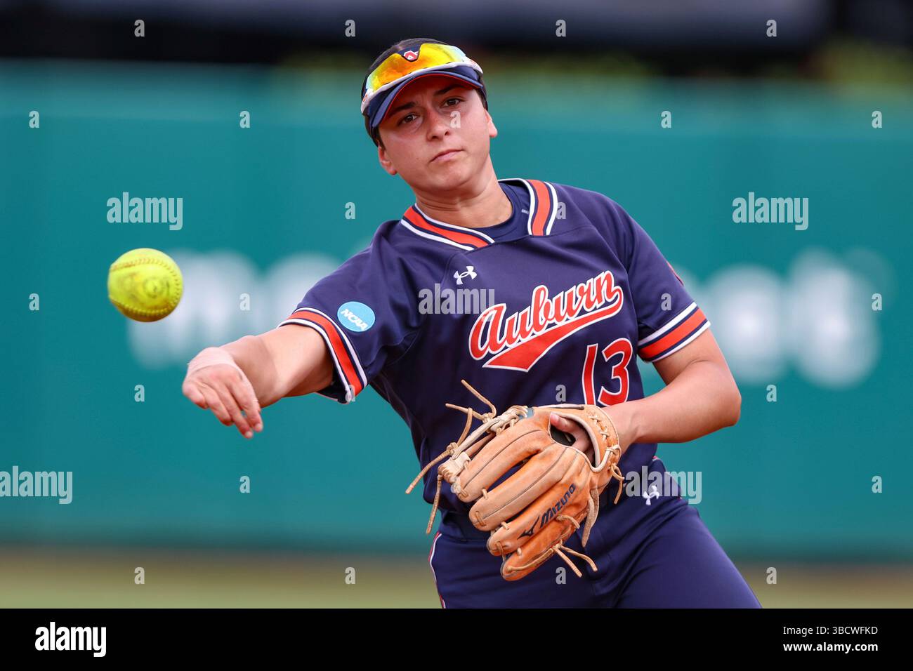 Auburn infielder Nelia Peralta (13) warms up before an NCAA regional