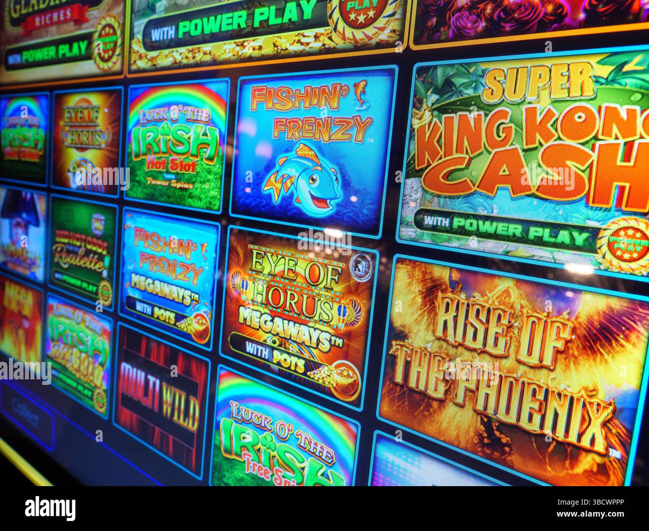 Screen showing variety of popular slot machine gambling games, UK Stock Photo