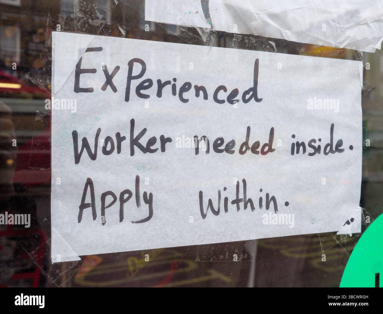 Hand written job vacancy sign in food shop window recruiting an experienced worker, London, UK Stock Photo