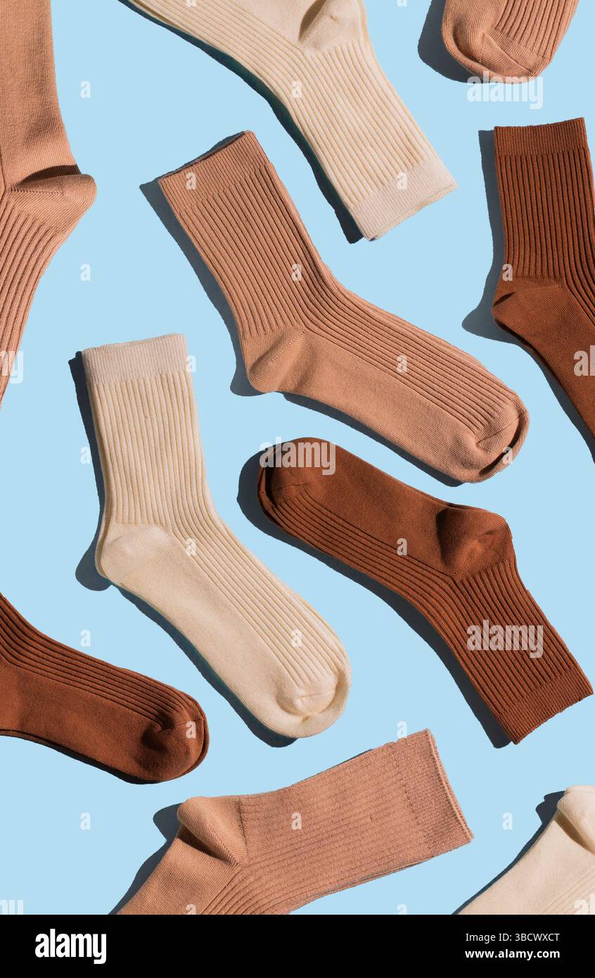 Collection of ribbed socks in shades of beige, brown, and cream is ...