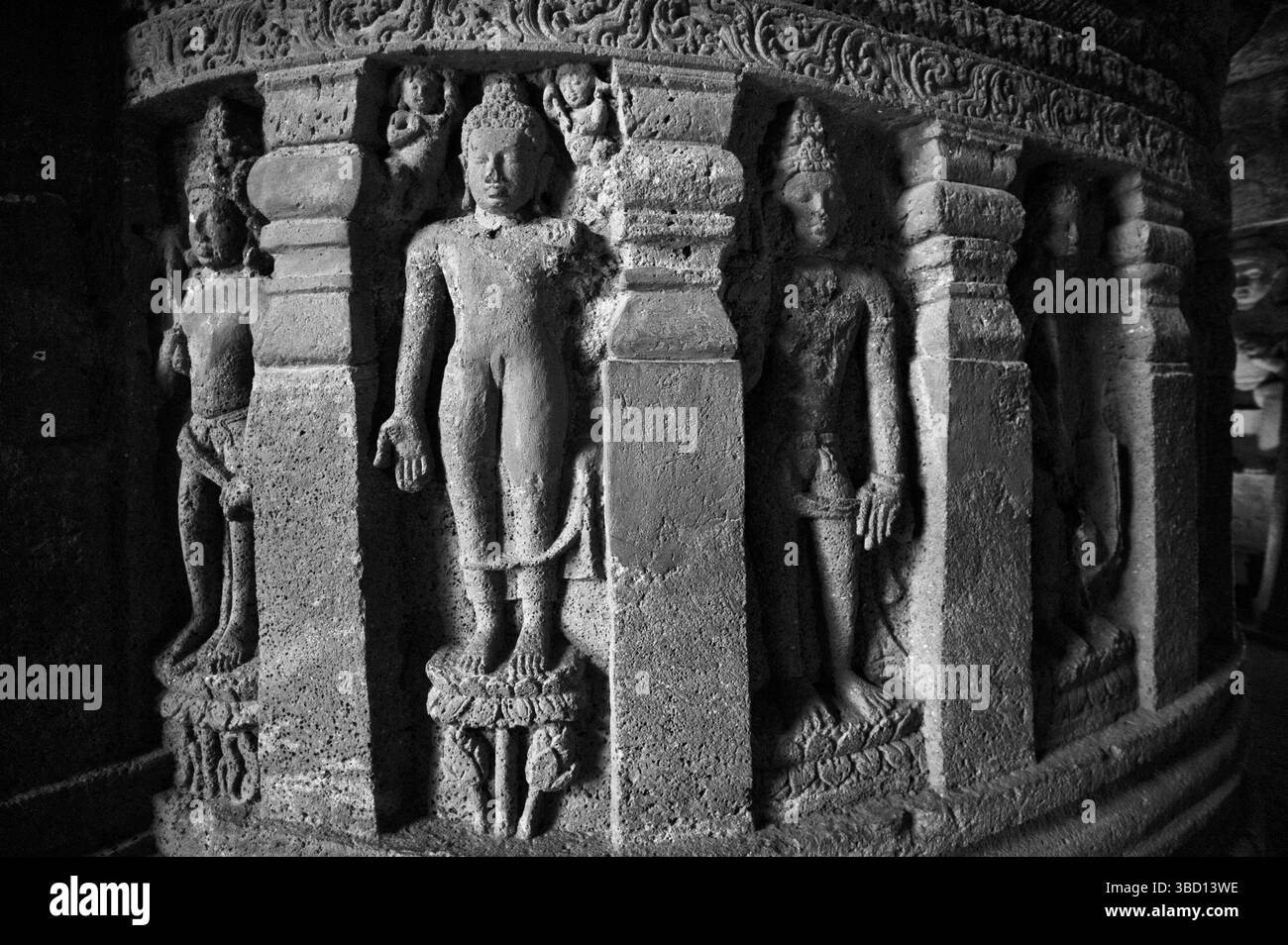 Black and white photo of standing buddha on stupa wall relief carving ...