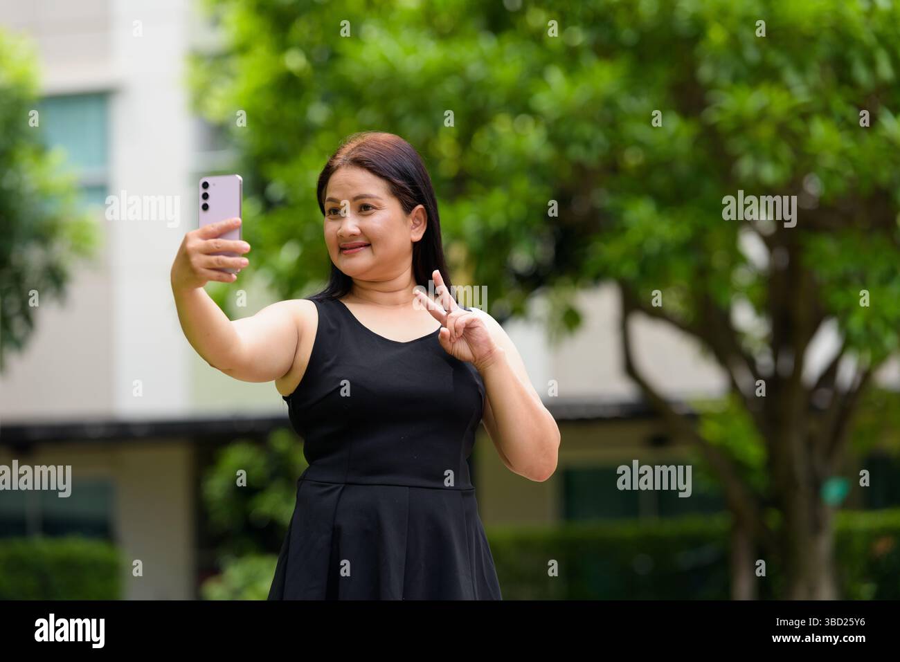 Asian mature woman in hi-res stock photography and images - Alamy