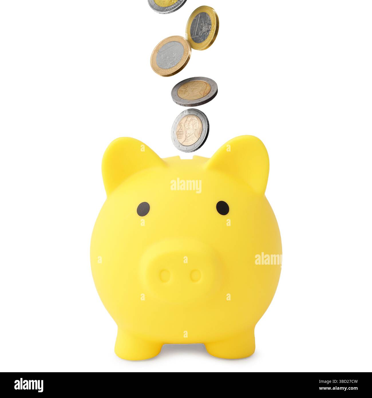 Coins falling into yellow piggy bank on white background Stock Photo ...