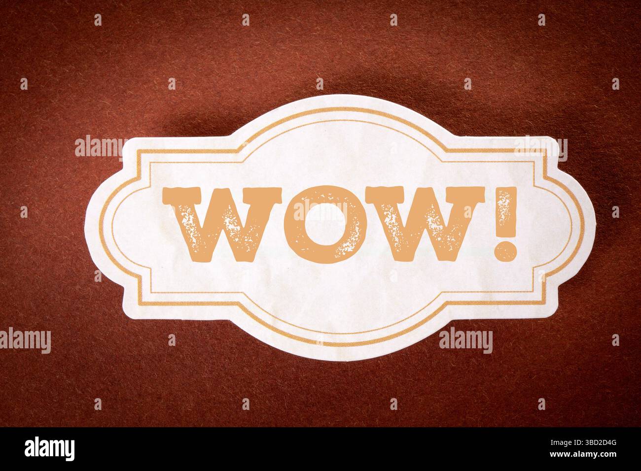 Wow Expression Label on Brown Background Representing Surprise or Excitement. Stock Photo