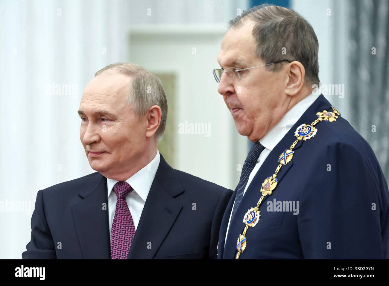 Russian President Vladimir Putin, left, awards Russian Foreign Minister ...