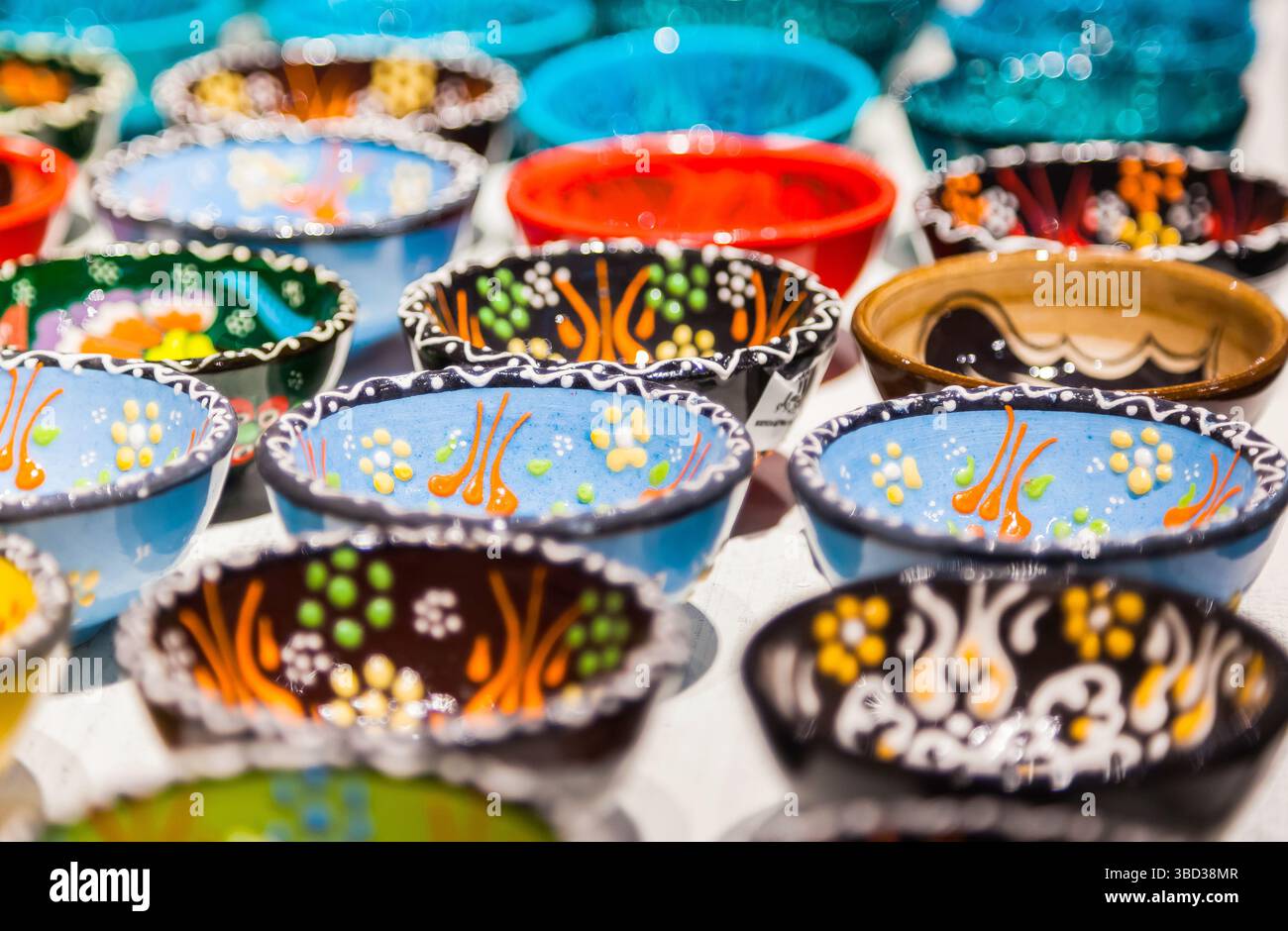 Hand painted ceramic plates on the table Stock Photo