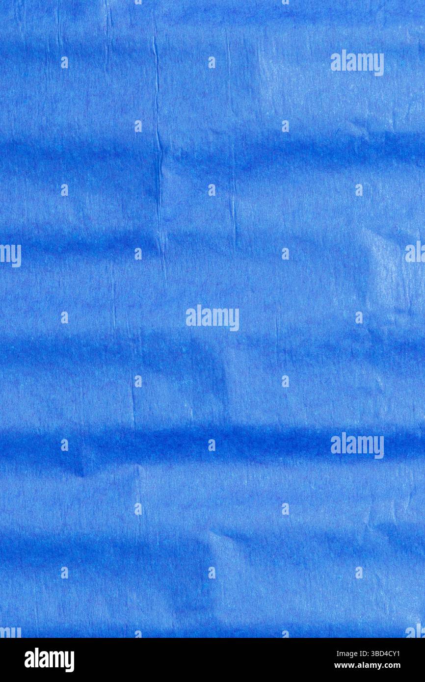 Blue crepe tissue craft paper background backdrop. Craft hobby material concept. Stock Photo