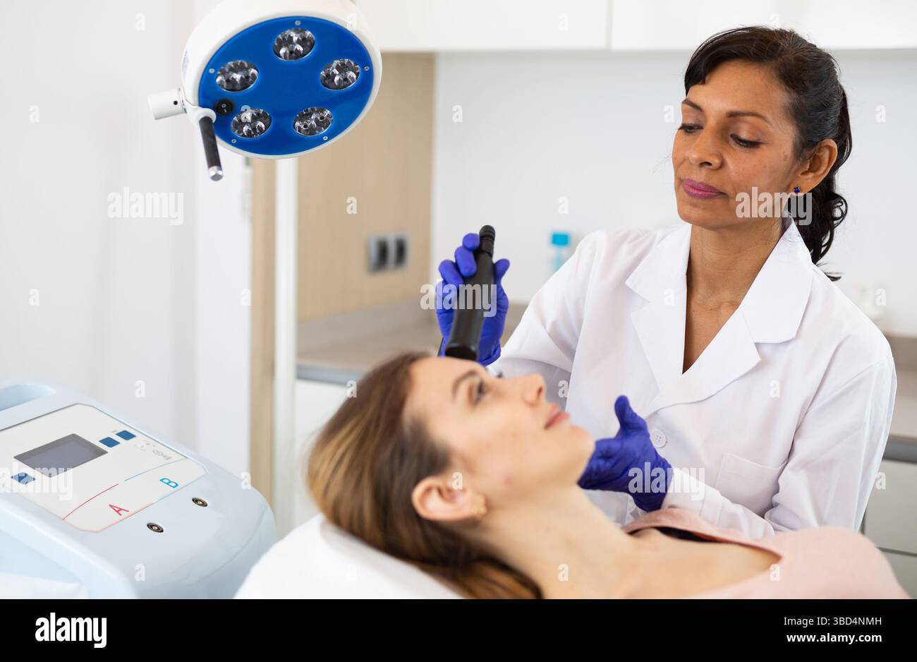 Woman receiving face ultrasound lifting procedure Stock Photo - Alamy