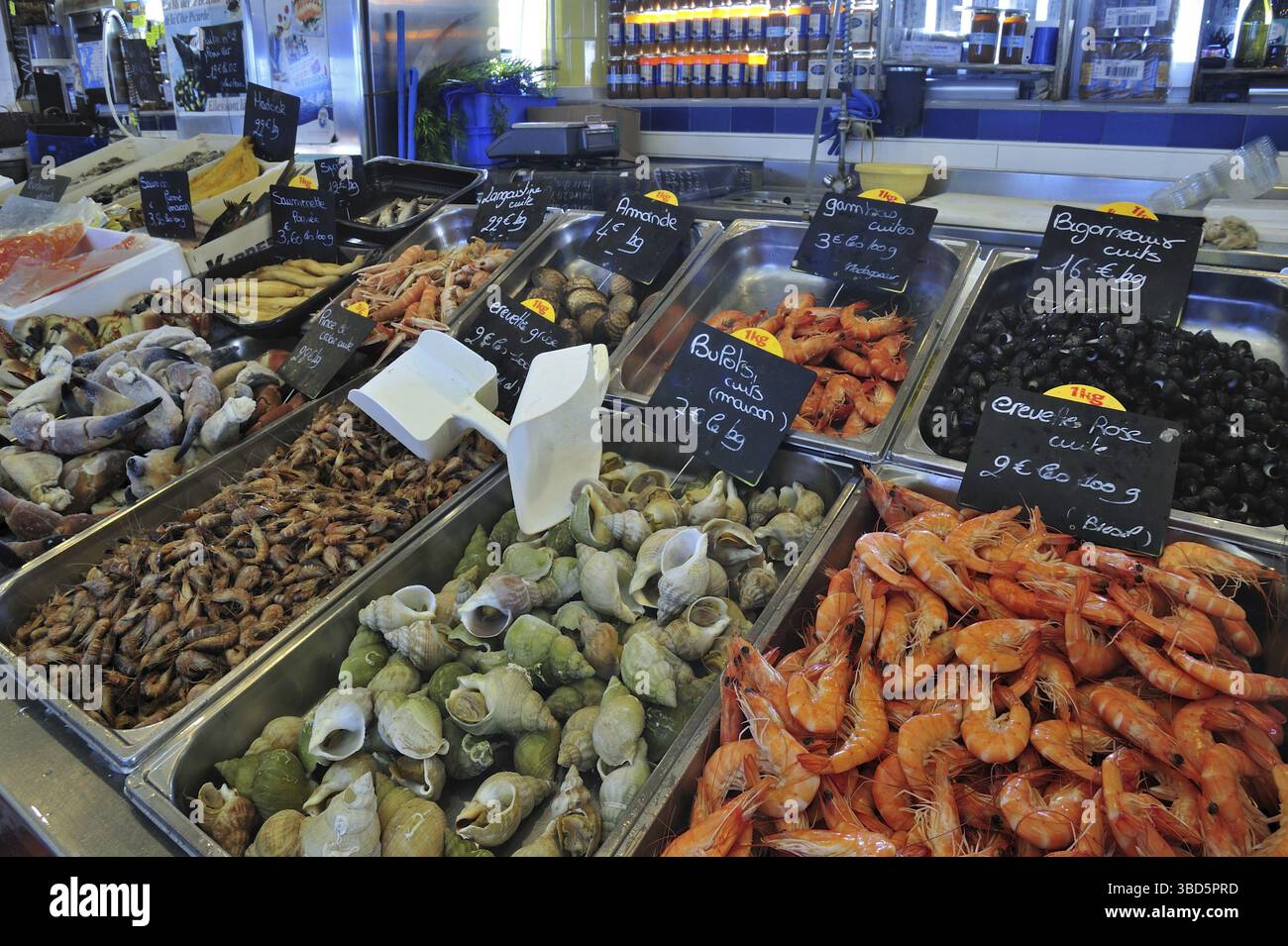 Fresh shellfish and seafood on display at fish market in the port of Le ...