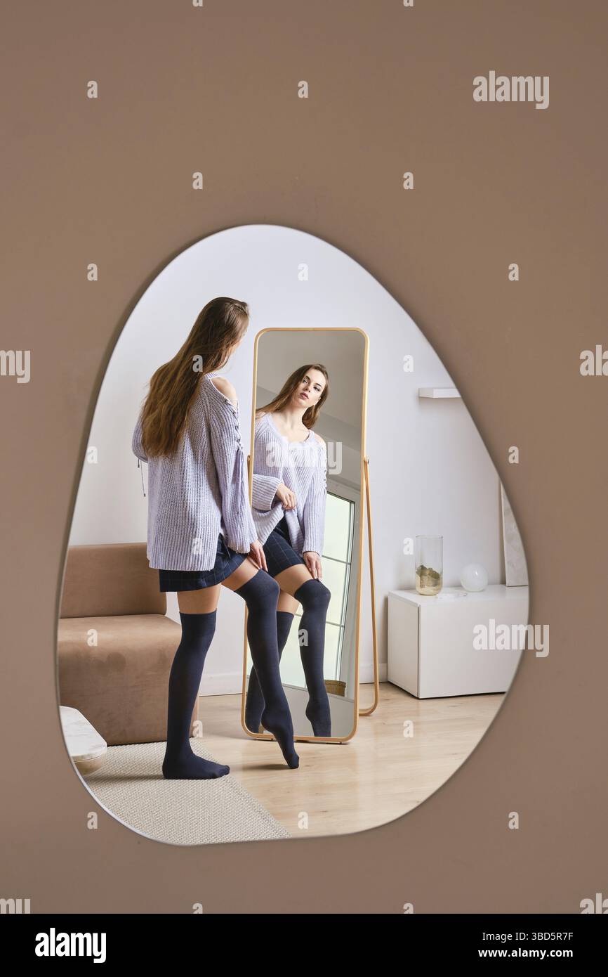 Woman in front of full length mirror hi-res stock photography and ...