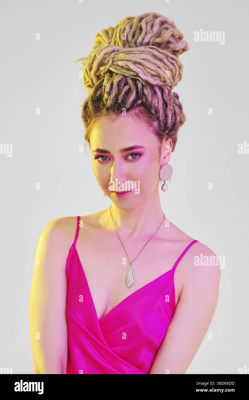 Model in bright pink dress hi-res stock photography and images - Alamy