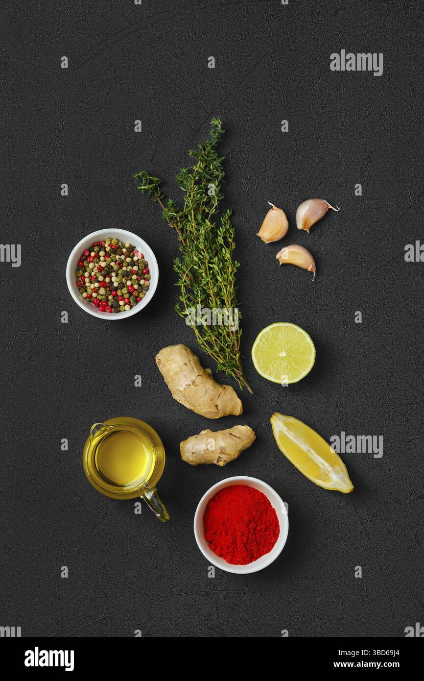Composition with condiments on black background. All purpose spice Stock Photo