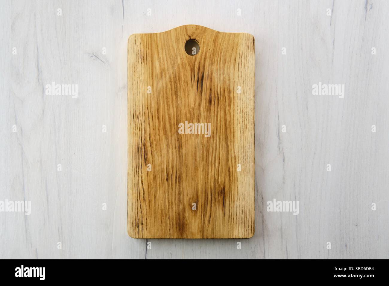 Overhead view of wooden cutting board Stock Photo