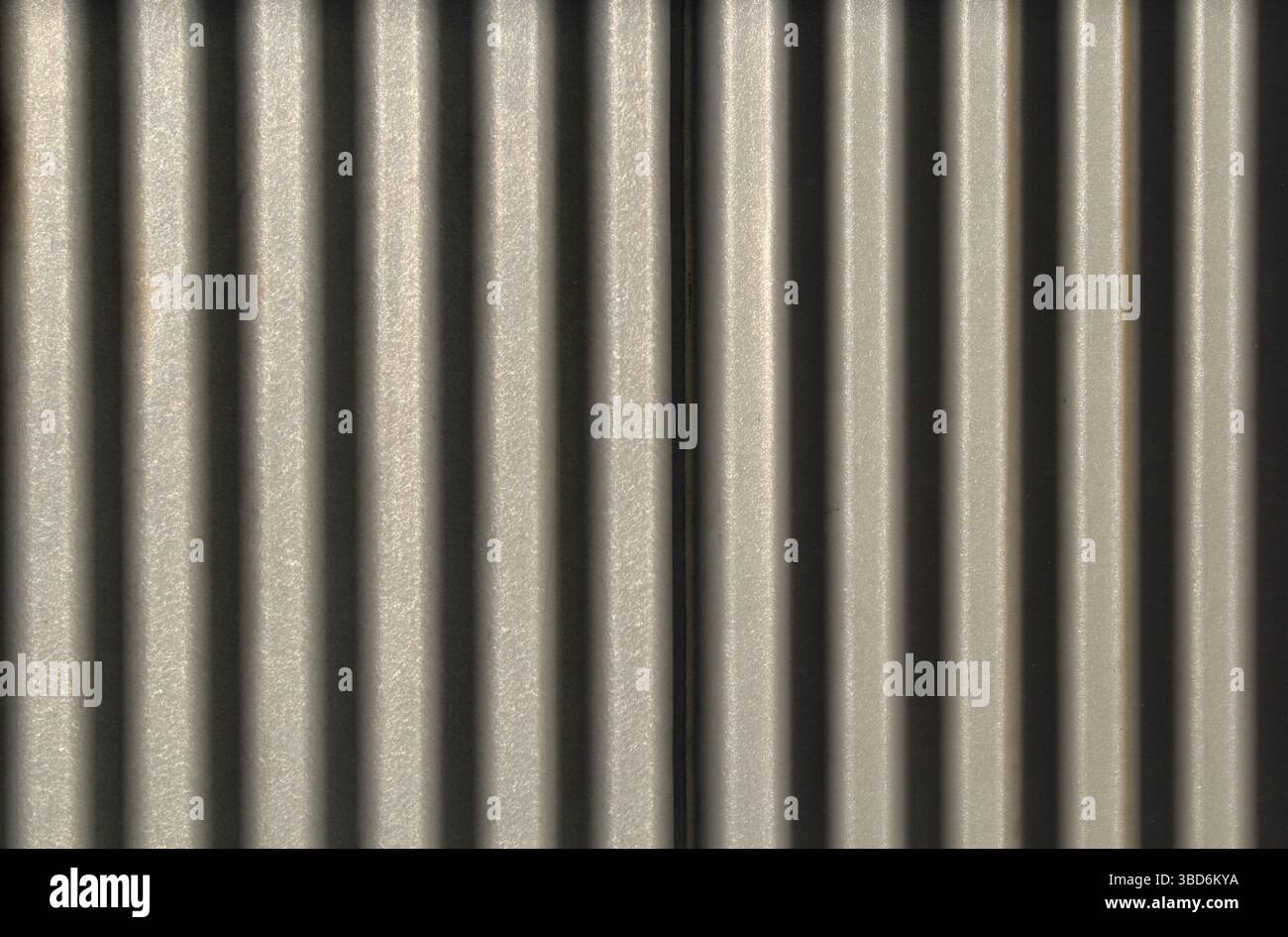 Close-up of a corrugated metal surface abstract textured background Stock Photo