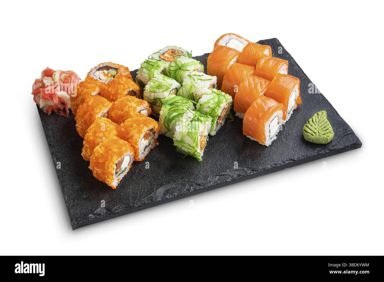 Big set of rolls with wasabi and pickled ginger on stone serving board isolated on white Stock Photo
