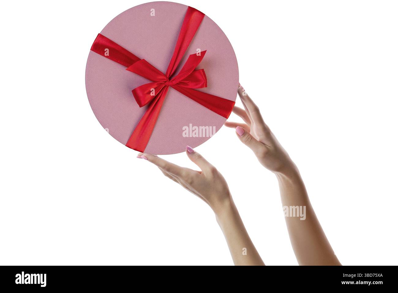 Female hands with pink round gift box isolated on white Stock Photo
